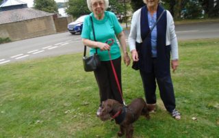 Trustees Ann and Deanna with Daisy who Ann adopted earlier in the year